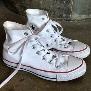 Slightly worn in Chucks in white